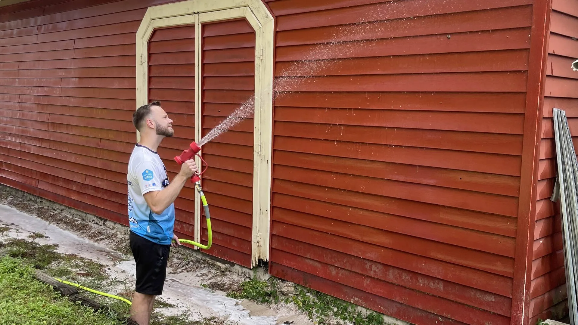 House exterior before soft washing — mold and algae staining
