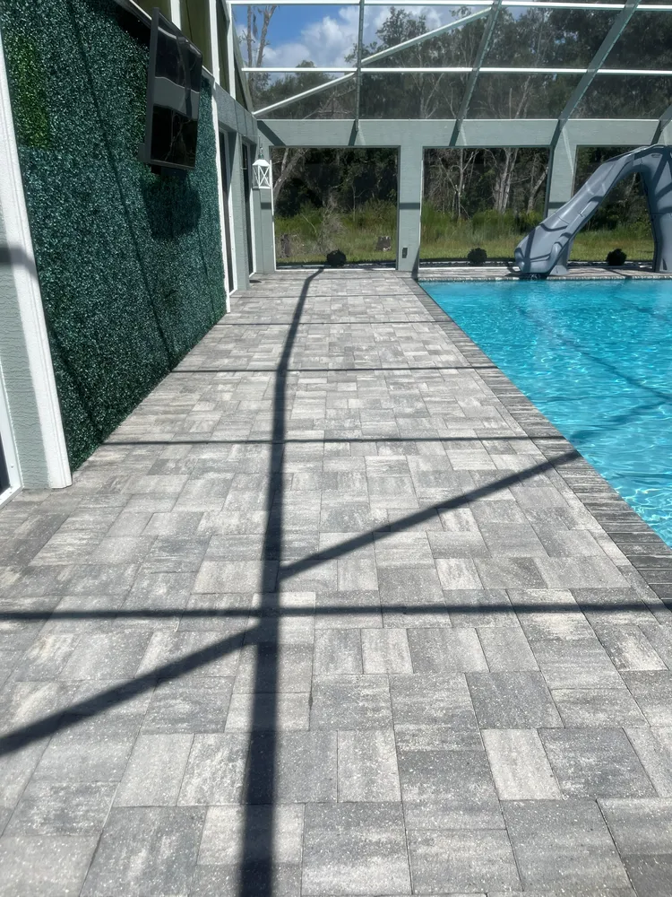Screened pool deck pavers cleaned and sealed with natural finish, Polk County FL