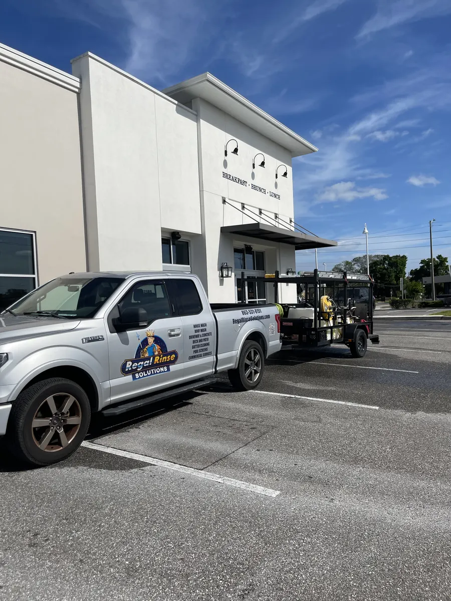 Regal Rinse Solutions truck in front of freshly cleaned commercial building