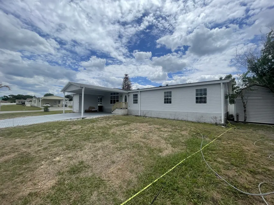 Mobile home exterior before soft washing — mold and grime on siding, Polk County FL