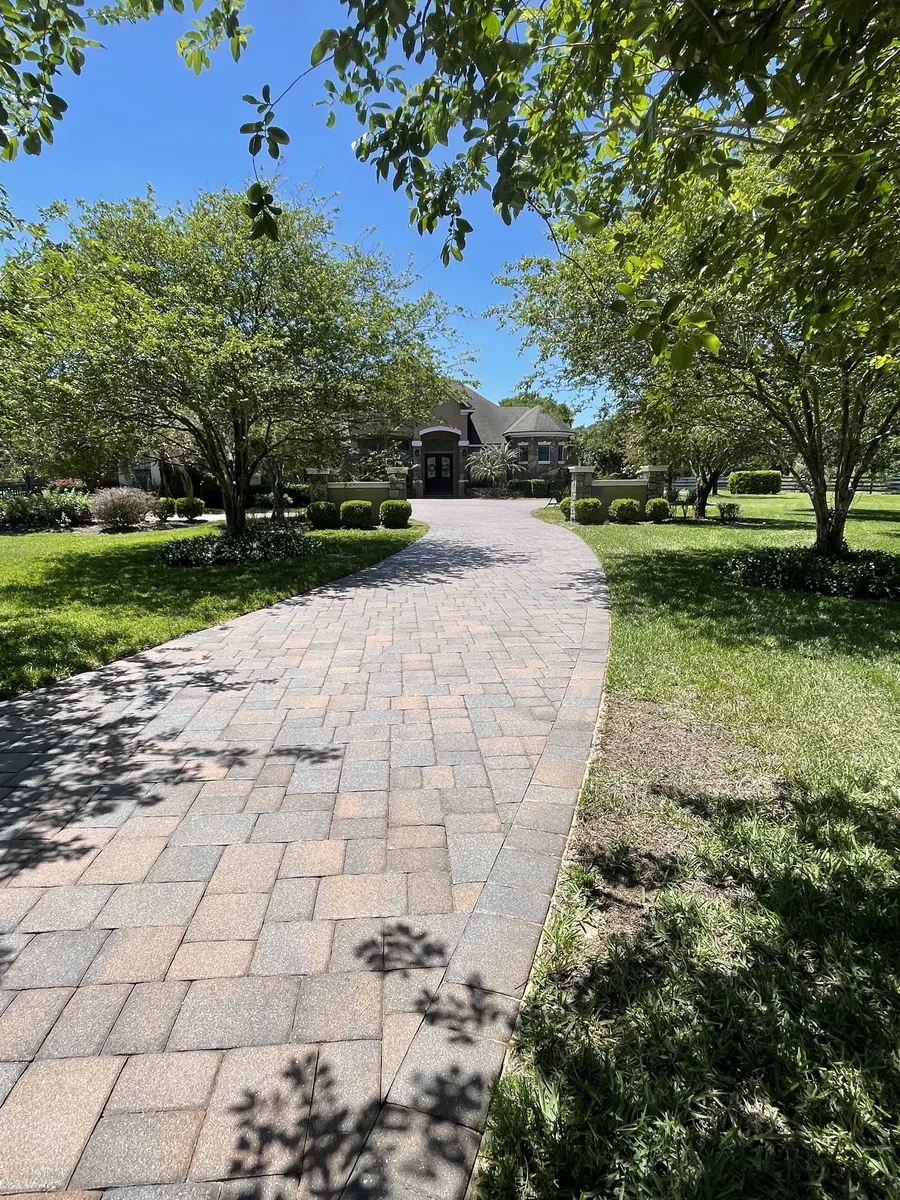 Long estate driveway entrance after paver sand and seal — Regal Rinse Solutions
