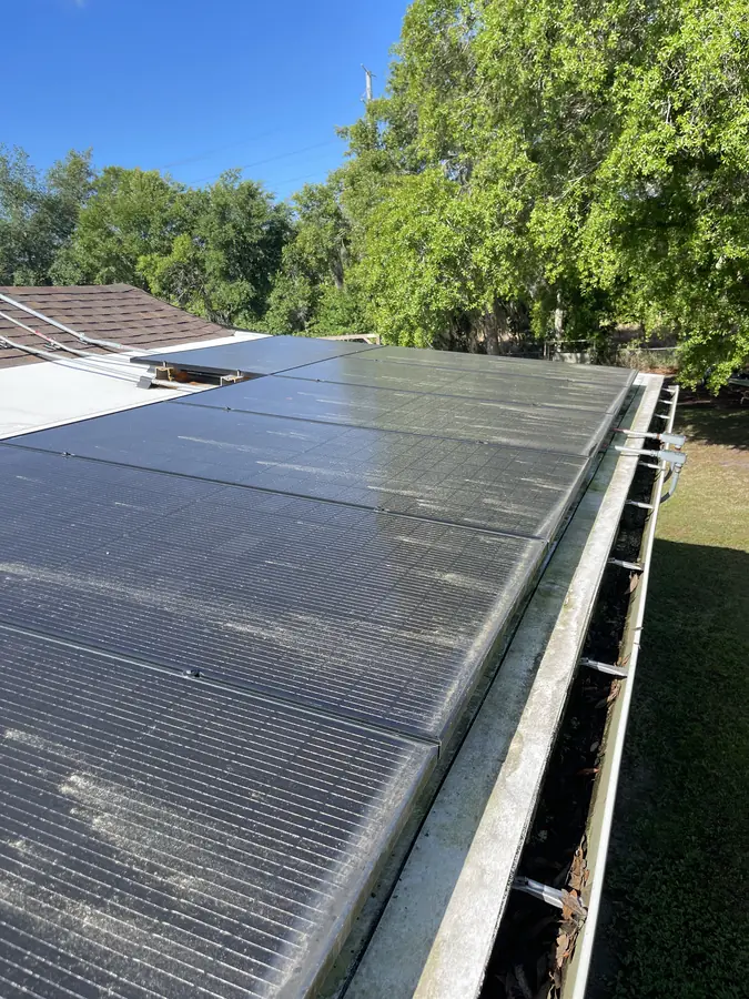 Solar panels before cleaning — pollen and algae buildup, Polk County FL
